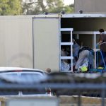 Photos show El Paso using refrigerated trucks in parking lots to store a backlog of bodies from a new COVID-19 surge